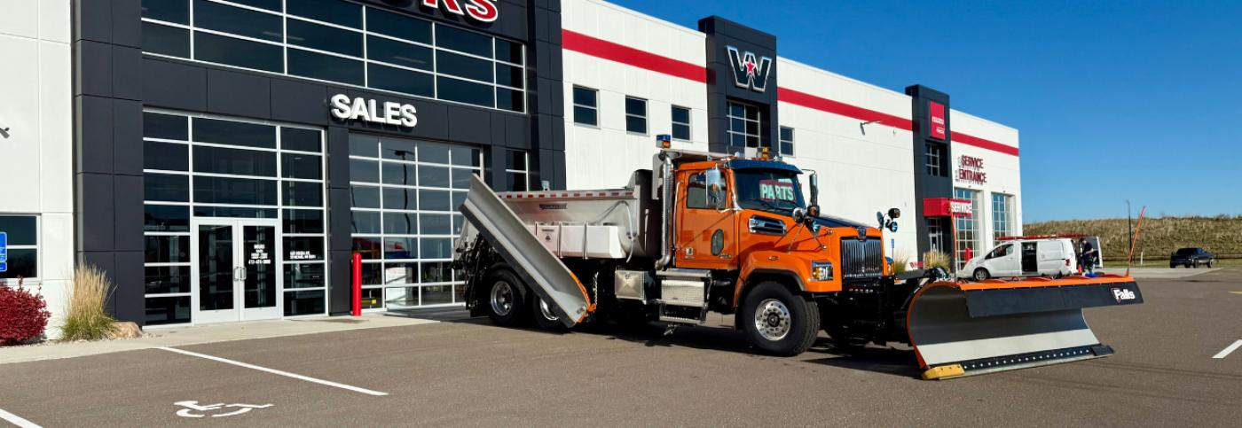 A Tandem-Axle Snow Plow in Front of Boyer Trucks in St. Michael, MN